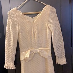 antique long sleeve dress with a bow as a belt